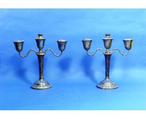 A pair of silver three-light Candelabra, by John Rose, hallmarked Birmingham, 1966, with reeded scroll branches and circular 