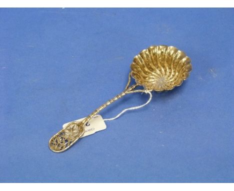 A Chinese silver Sifter Spoon, circa early-20thC, unmarked, of traditional form, the spiral fluted bowl with foliate decorati