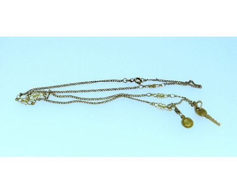 An 18k yellow gold Chain, with five fancy links and with an 18k key suspended and a Madonna plaque also suspended, 6.8g. THIS