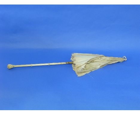 A late 19thC / early 20thC Parasol, the ivory handle with carved decoration, on a folding shaft with ring-finial, 25in (63.5c