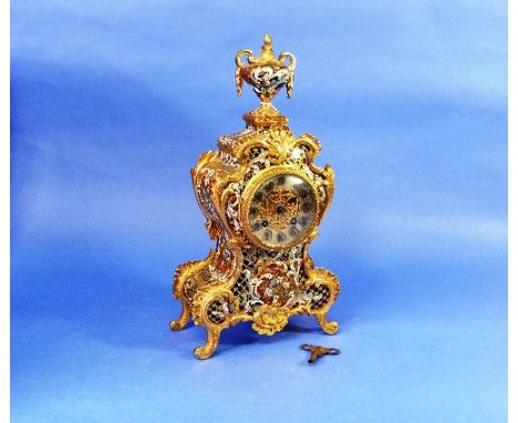 A French gilt brass and Champleve enamel Mantel Clock, of waisted Rococo form with vase finial, the dial with silvered chapte