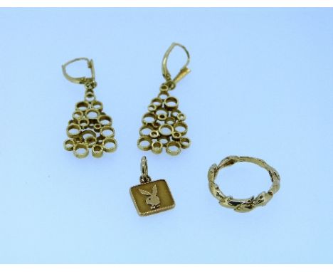 A pair of 14k drop earrings of triangular form, made of various sized open circles, together with a 14k yellow gold 'twig' ri