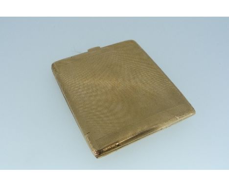 A 9ct gold Cigarette Case, of hinged rectangular form with engine-turned decoration, Birmingham hallmarks, impressed "Trade M