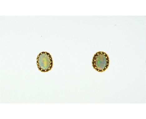 A pair of 9ct yellow gold oval opal ear studs, the opals with ropework borders. THIS LOT WILL BE SOLD ON SATURDAY 12TH SEPTEM