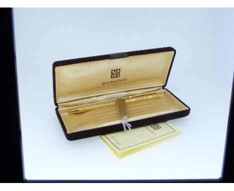 Givenchy; a gold-plated retractable ball-point pen, 5¼in (13.25cm) long, cased with instruction leaflet. THIS LOT WILL BE SOL