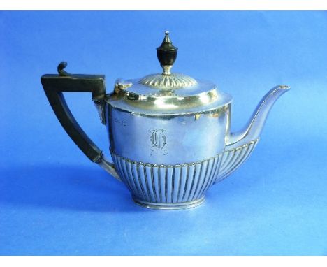 A Victorian silver Tea Pot, by Army & Navy Cooperative Society Ltd, hallmarked London, 1888, of oval form with demi-fluted de