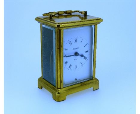 A French gilt brass three-glass Carriage Clock, by Duverdrey & Bloquel, the white dial with black Roman numerals and signed "