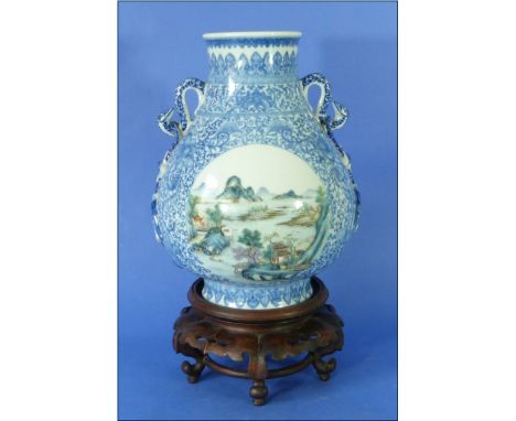 An early 20thC Chinese blue and white porcelain Hu-shaped Vase, bearing Qianlong six-character seal mark, painted with scroll