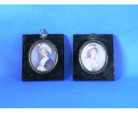 A 19thC portrait miniature of a young woman, oval, in papier mâché frame, 3½in (9cm) high, together with another (2) THIS LOT