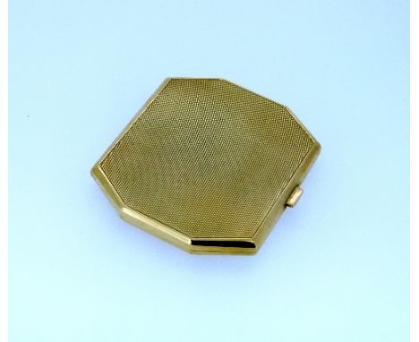 A stylish Art-Deco octagonal 9ct yellow gold Powder Compact, the top nad base engine turned, the interior with inset mirror a