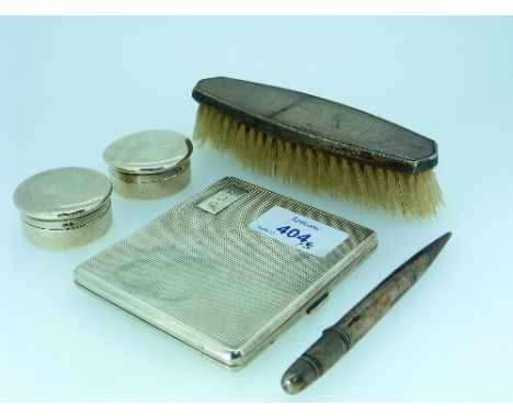 A George V silver Cigarette Case, hallmarked Birmingham, 1939, with engine turned decoration, 3¾in (9.5cm) wide, together wit