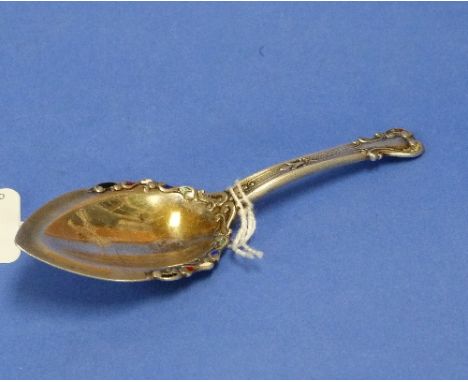 An early 20thC silver Caddy Spoon, marked "Sterling", the bowl with enamel decoration, 3⅞in (9.75cm) long. THIS LOT WILL BE S
