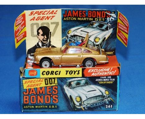 Corgi No.261 James Bond's Aston Martin D.B.5., gold with red interior and wire wheels, James Bond and bandit figure, boxed wi