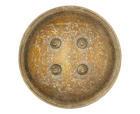 A NORTH INDIAN HIGHLY DECORATED COPPER ALLOY SHIELD (DHAL), 19TH CENTURY, PROBABLY RAJPUT of circular convex form with outwar