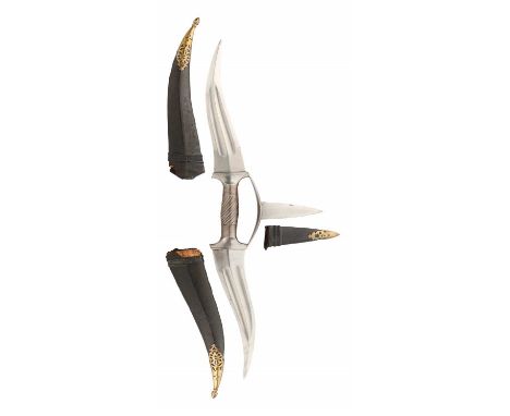 A NORTH INDIAN DOUBLE-ENDED PARRYING DAGGER, PROBABLY 19TH CENTURY RAJASTHAN formed of a khanjar-like wavy double-edged fulle