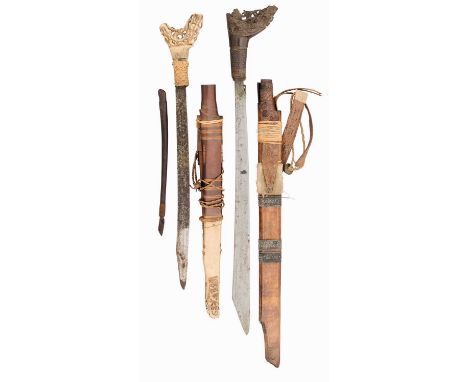 TWO DYAK SWORDS (MANDAU), BORNEO, LATE 19TH/20TH CENTURY of characteristic form, the first with single-edged blade, perhaps f