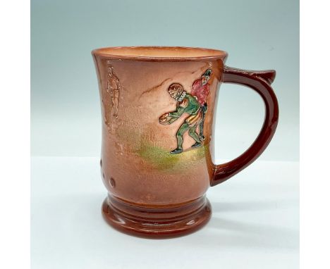 Light brown glazed over cream-color ground body; embossed images of Sir Francis Drake bowling with his companions. Royal Doul