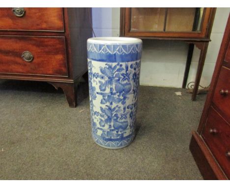 A cylindrical blue and white stick stand/floor vase with floral decoration, 44cm high 