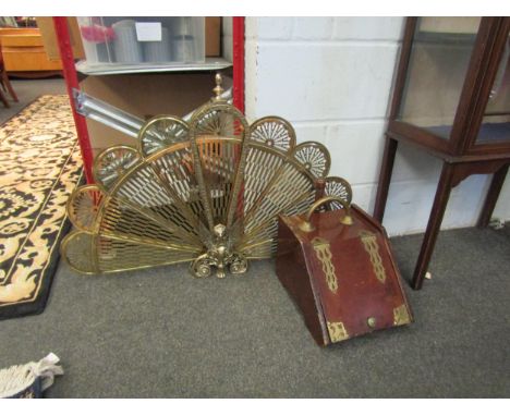 A brass peacock fire screen and a coal scuttle with scoop 