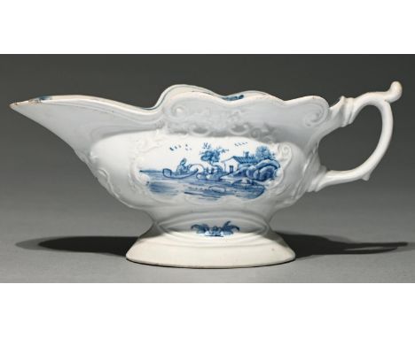 A Worcester blue and white sauceboat, c1755, of press moulded, wavy edged and high footed form, painted with the Triangular P