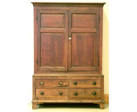 A George III oak press, late 18th c&nbsp;flared cavetto cornice above a pair of raised, fielded twin panelled doors, the base