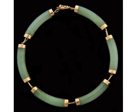 A South East Asian gold mounted jade bracelet,&nbsp;the clasp in the form of a shou character, marked 14k, 11.5g Good conditi