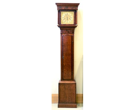 An oak eight day longcase clock, 20th c, the 12" brass dial with silvered chapter ring and mask spandrels, in flat topped mah