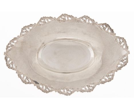 An Edwardian silver fruit dish, with die stamped and pierced border to the widely everted rim, 29cm l, by Walker &amp; Hall, 