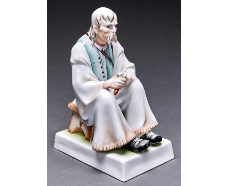 A Zsolnay porcelain figure of a man cutting wood, 20th c, 33cm h, blue printed mark, sepia painted signature Good condition