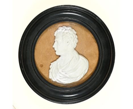 A bas relief portrait of Lord Byron, white painted plaster or other substance, probably 19th c, ebonised frame, 14.5cm diam G