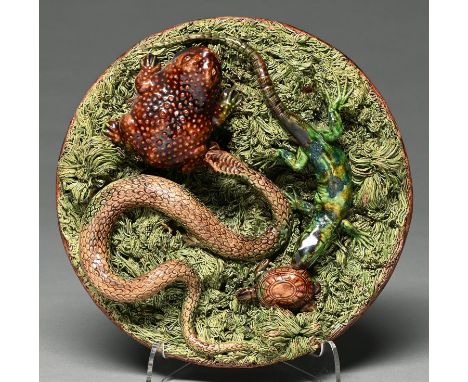 A Portuguese Palissy ware dish, M. Mafra, late 19th c, applied with a snake and lizard, each biting the foot of a toad or tor