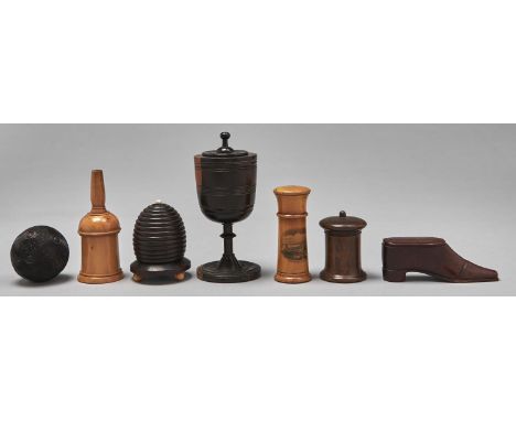 Treen. A Lignum Vitae cup and cover, Victorian sycamore glover powderer, a Victorian fruitwood shoe novelty snuff box and sli