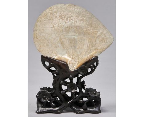 A Chinese export mother of pearl shell carving, 19th c,&nbsp;with a procession winding through a landscape, 26cm h overall an