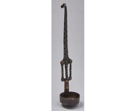 An Indian brass and iron ladle, 19th c, the bowl on decorated stem with spiral ornament and hook end, 37.5cm Complete and in 