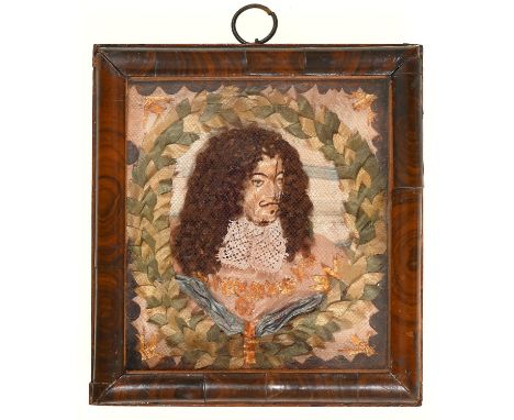 A silk, lace, applique and painted relief portrait of the head of King Charles II, 19th c,&nbsp;beneath fine red net, in moul