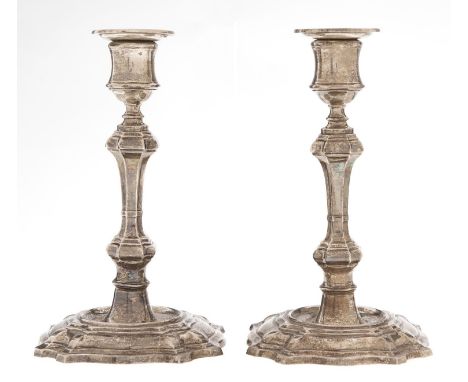 A pair of George V silver candlesticks, in George II style, nozzles, 18.5cm h, loaded, marks rubbed, by W Hutton &amp; Sons L