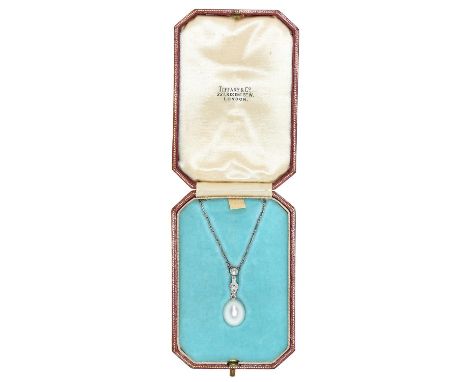A cultured pearl and diamond pendant,&nbsp; the ovoid cultured pearl of approx 13mm, suspended from an articulated diamond li
