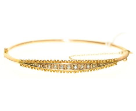 A split pearl bangle, in gold, 65mm, unmarked, 4.7g Lacking one split pearl, slightly dented/creased