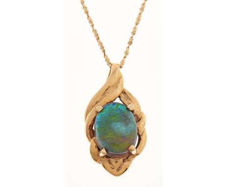 A black opal pendant, in gold marked 18k, on a gold necklet marked 750, 2.2g Good condition