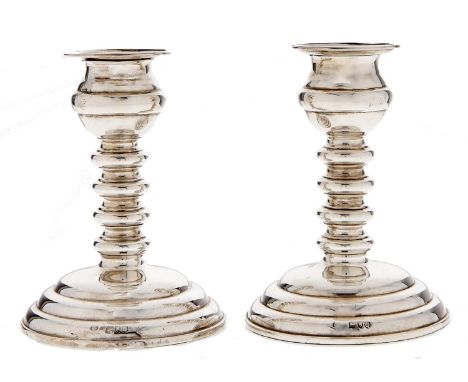 A pair of Victorian silver dwarf candlesticks, with spool knopped stem, on round tiered foot, 11cm h, by Horace Woodward &amp