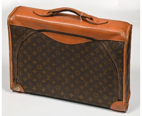 Vintage Luggage. A Louis Vuitton zipped bag, stitched tan leather trim and handle, 48cm l, maker's label MANUFACTURED BY THE 