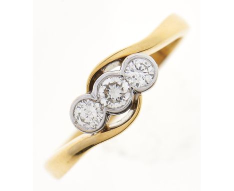 A three stone diamond crossover ring, in 18ct gold, 2.9g, size K½ Good condition