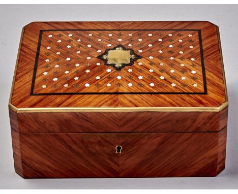A French tulipwood necessaire, c1870, in matched veneers inlaid with brass and mother of pearl with florets around a vacant c