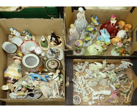 A quantity of bisque porcelain miniatures, late 19th / early 20th c, figurines, etc; together with porcelain bird ornaments b