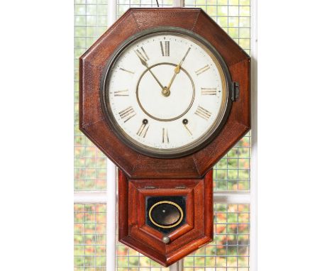 A North American stained wood drop case octagonal wall clock, c1900,&nbsp;with fragmentary Seth Thomas label, pendulum, 55cm 