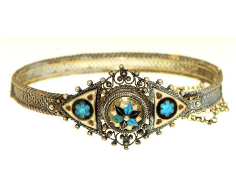A silver openwork and enamel bangle, approximately 67mm Minute chip and a few scratches on enamel visible under magnification