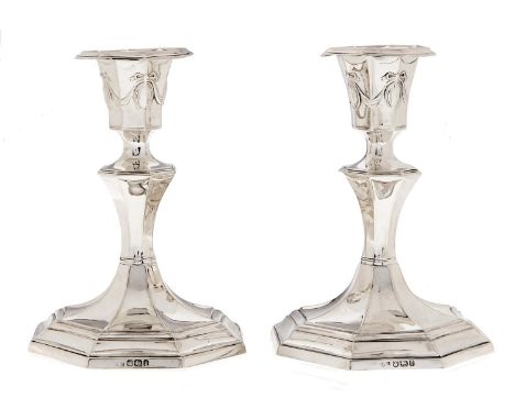 A pair of Victorian silver dwarf octagonal candlesticks, nozzles, 14cm h, by John Round &amp; Son Ltd, Sheffield 1897, loaded