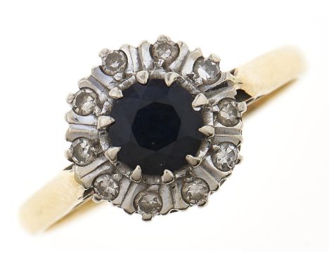 A sapphire and diamond cluster ring, in 18ct gold, 3.9g, size Q Slight wear scratches