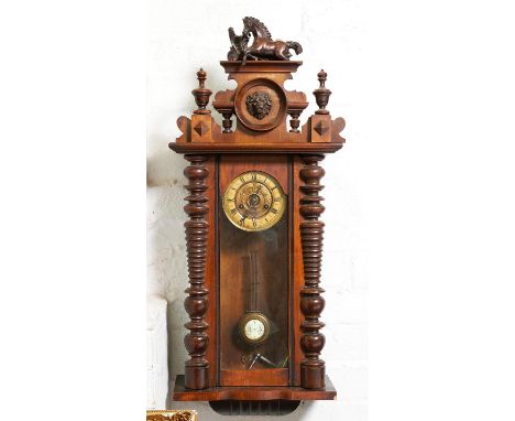 A walnut Vienna wall clock, c1900, with painted composition rearing horse finial, gridiron pendulum, 102cm h Small veneer chi