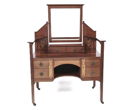 A Liberty style inlaid mahogany dressing table, late 19th c,&nbsp;the central bevelled plate supported by a pair of shaped pa